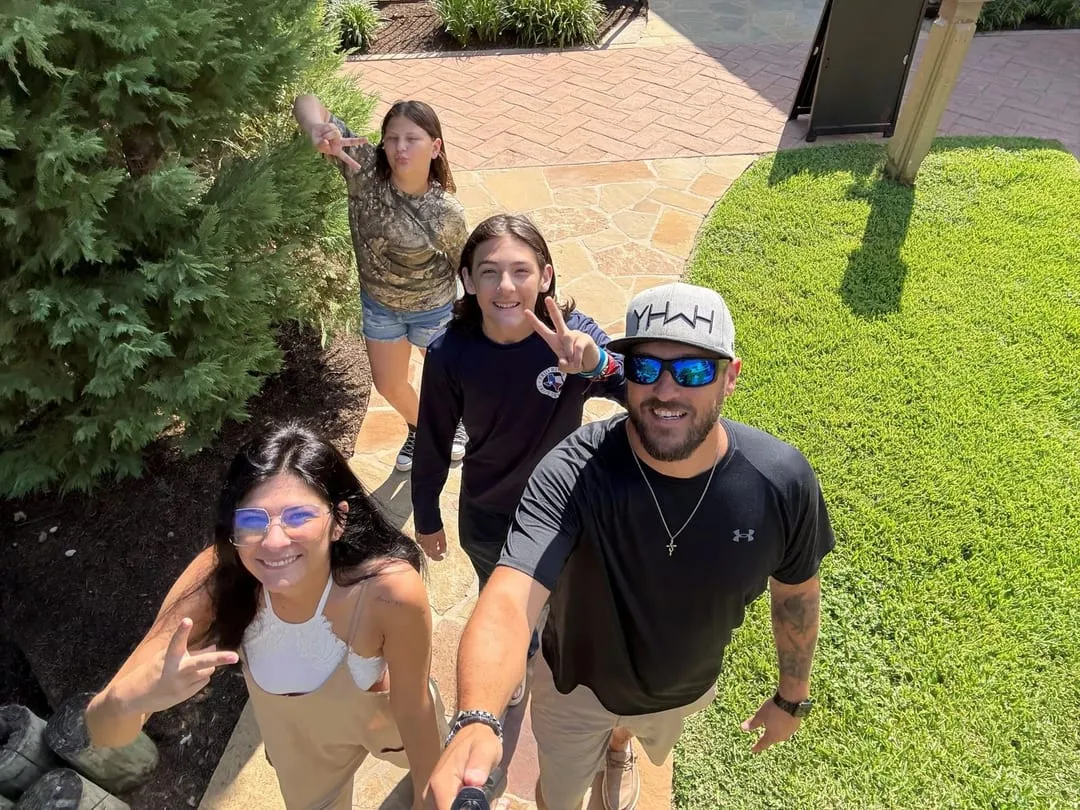 Brandt with his family outdoors at home.